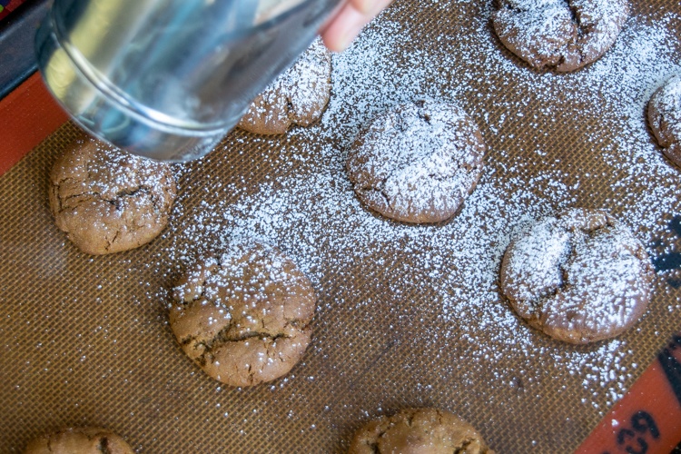 Sprinkle powdered sugar generously on the molasses cookies
