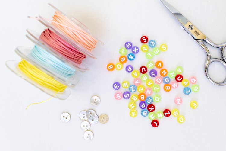 Supplies for making friendship bracelets with letter beads
