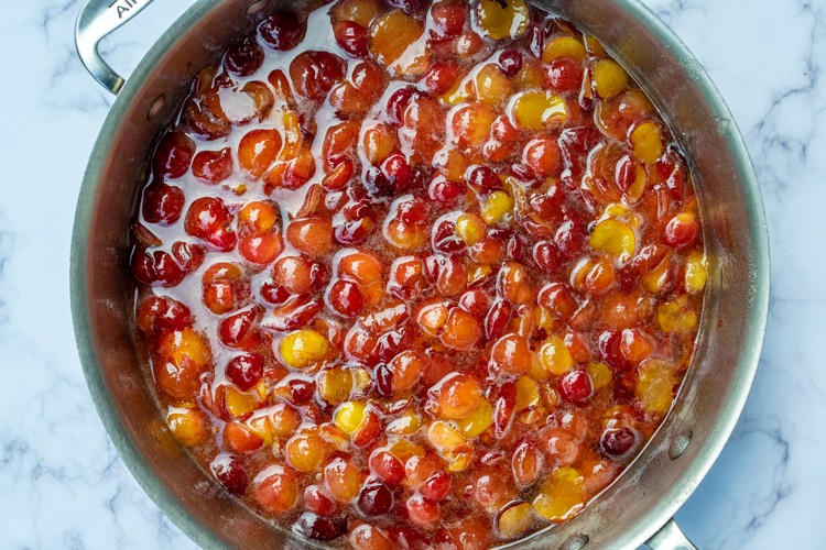 Plums and sugar mixed for jam
