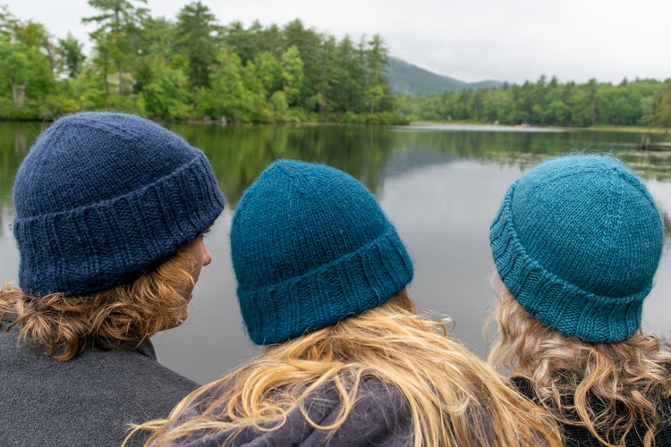 the knit hat in the wild, three different colors and yarns
